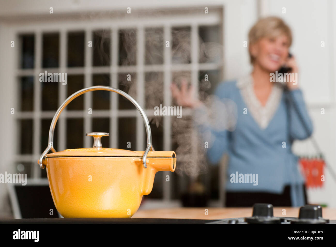 Steaming kettle on stovetop Stock Photo Alamy