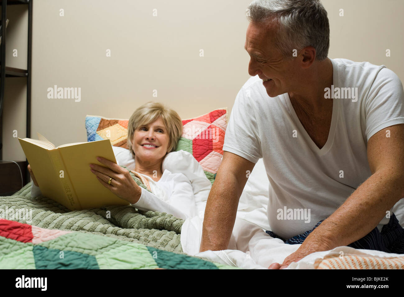 Seated man reclining woman hi-res stock photography and images - Alamy