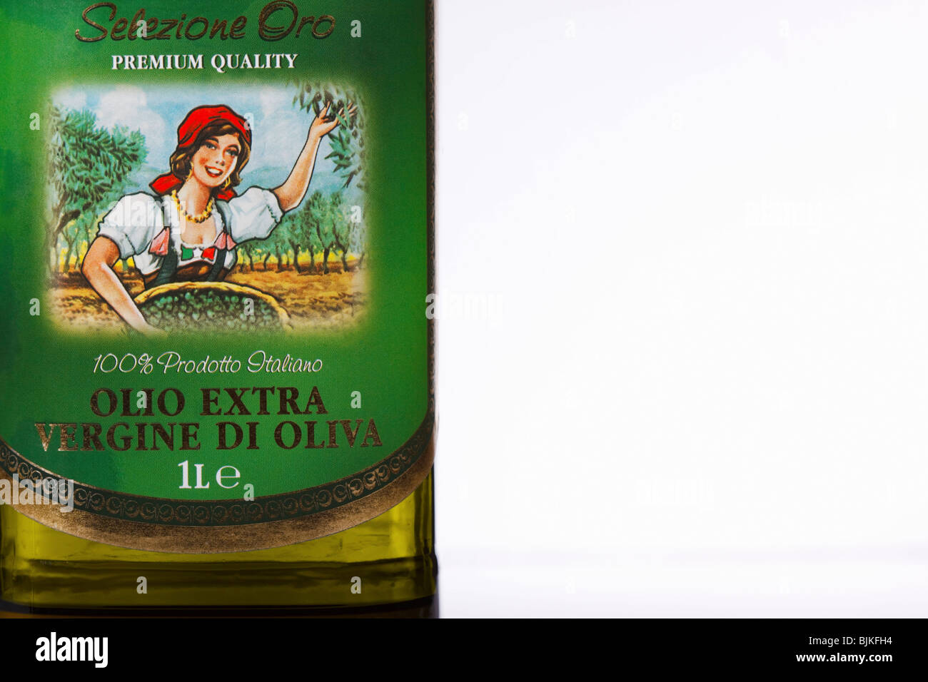 Abstract view of a bottle of extra virgin olive oil. Olea europaea; family Oleaceae. Isolated. Copy space. Stock Photo