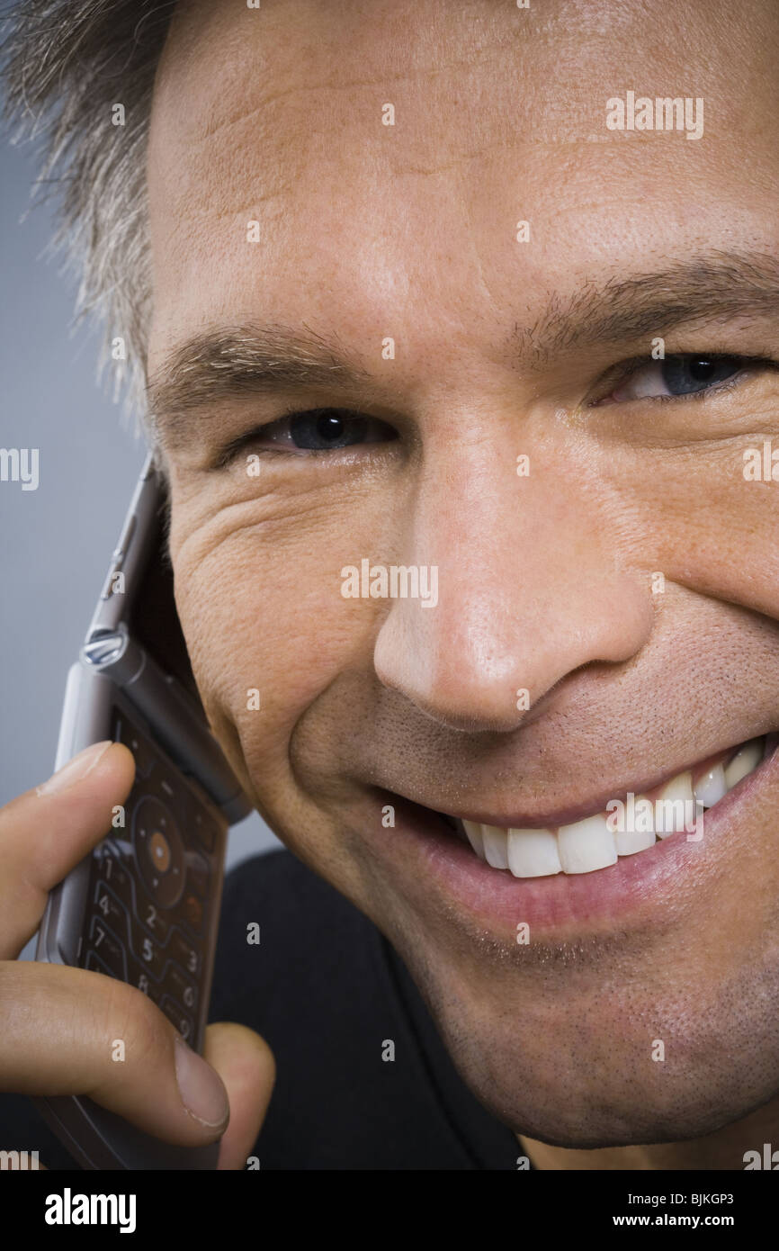 Closeup of man talking on cell phone Stock Photo