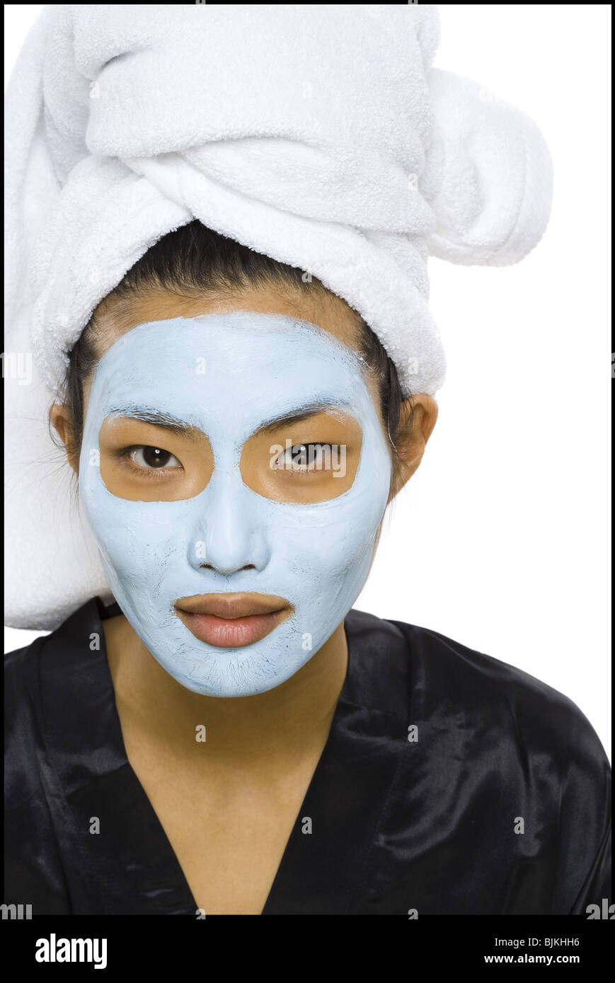 Closeup of woman with facial mask and hair towel Stock Photo Alamy