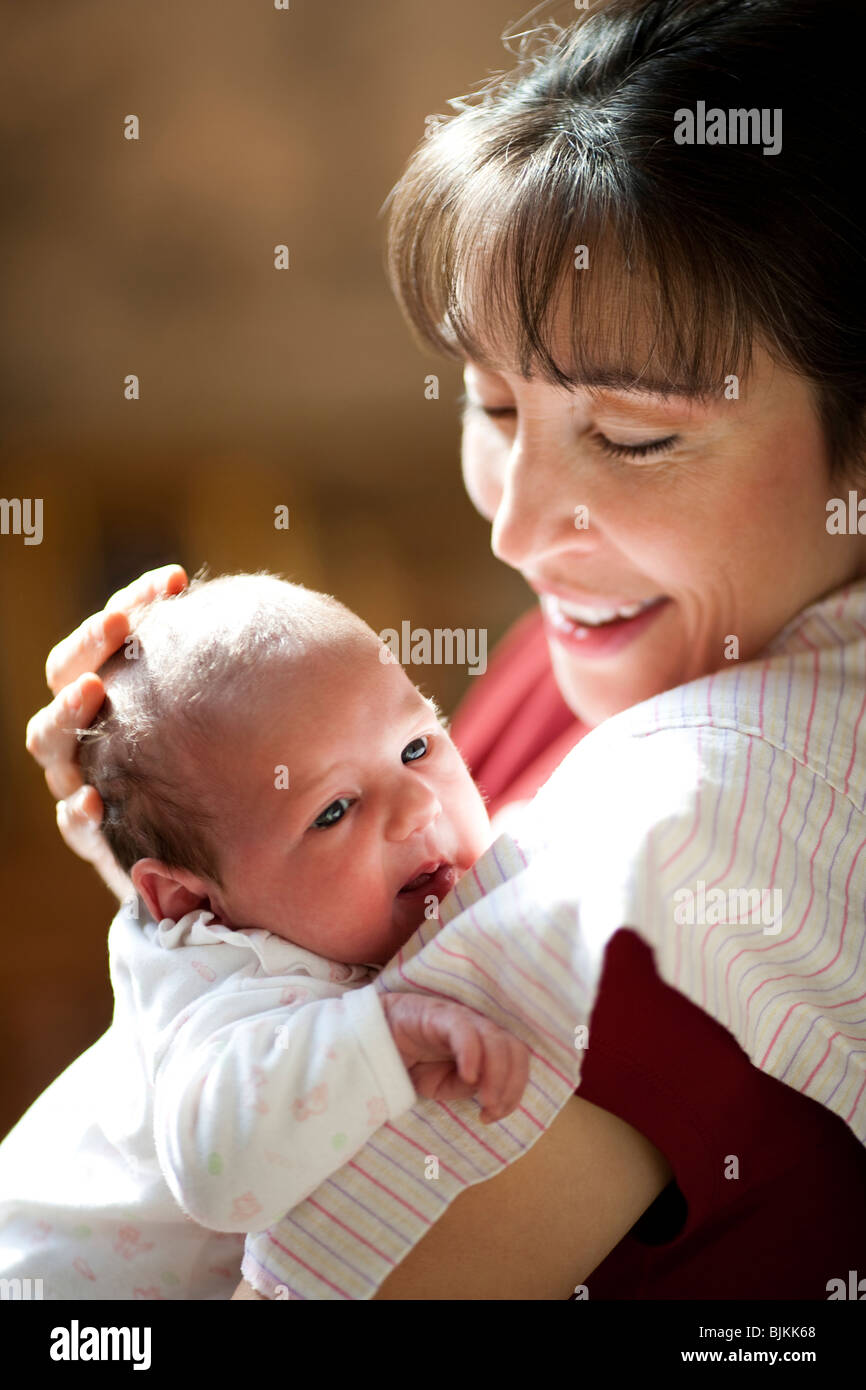 Woman holding newborn Stock Photo