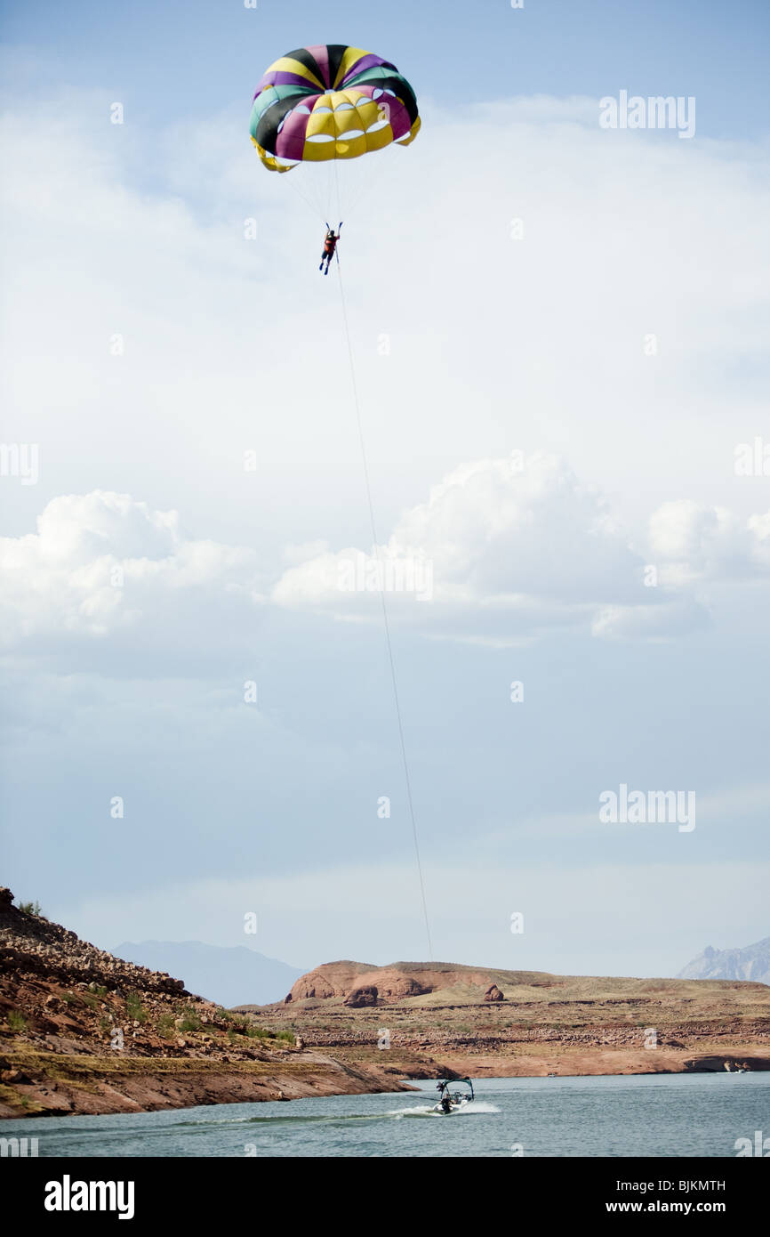 Man with parachute floating Stock Photo