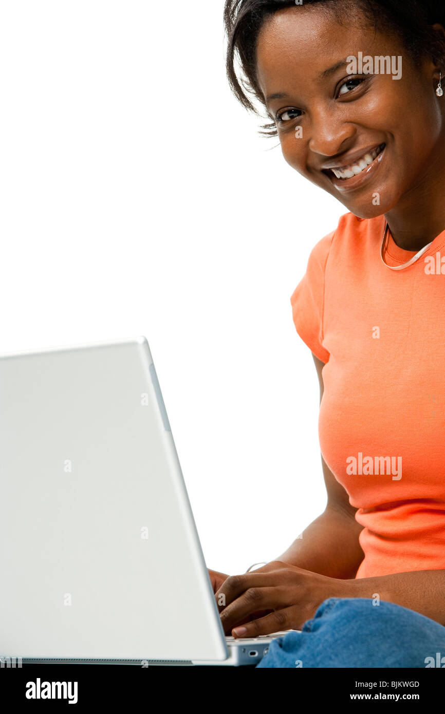Woman with laptop sitting cross legged Stock Photo