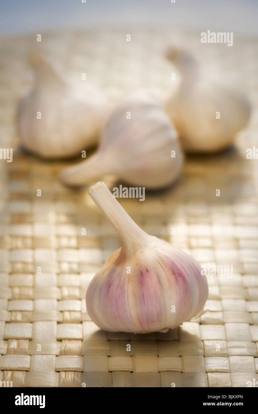 White tinged with pink garlic bulbs in a basket Stock Photo