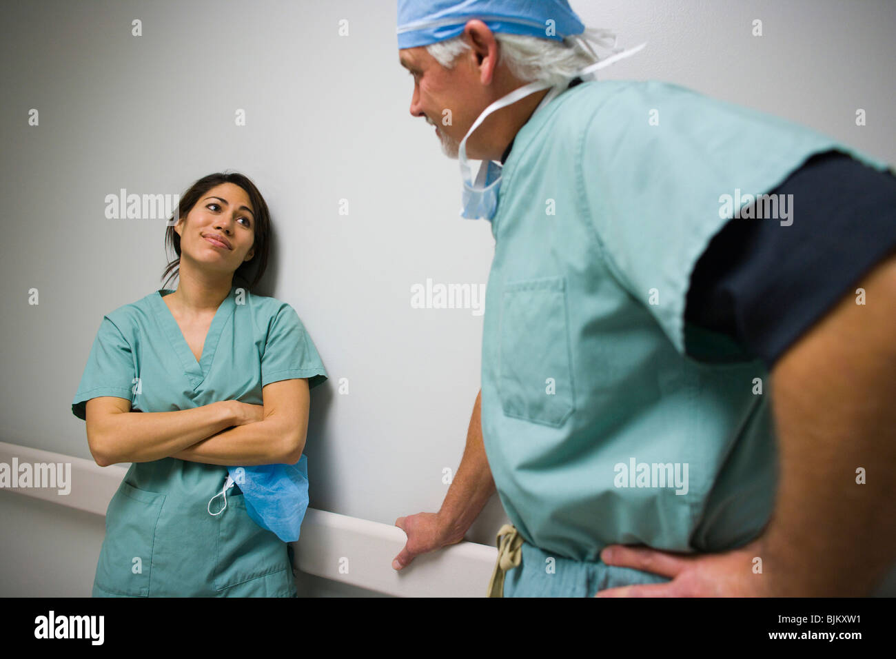 Doctor and nurse in scrubs talking Stock Photo