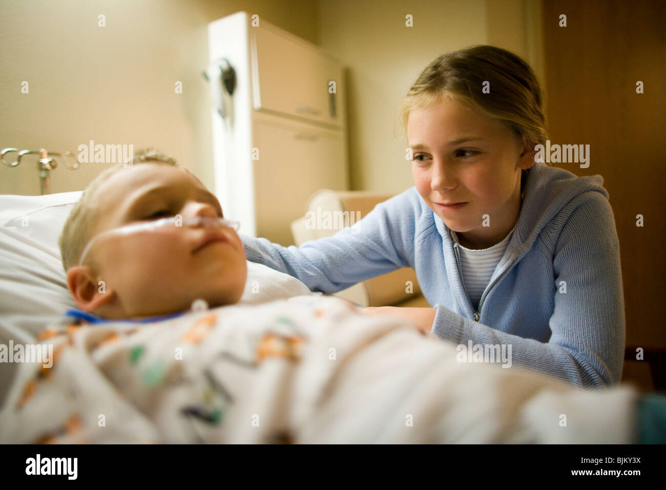 Brother worry sister hospital bed hi-res stock photography and images ...