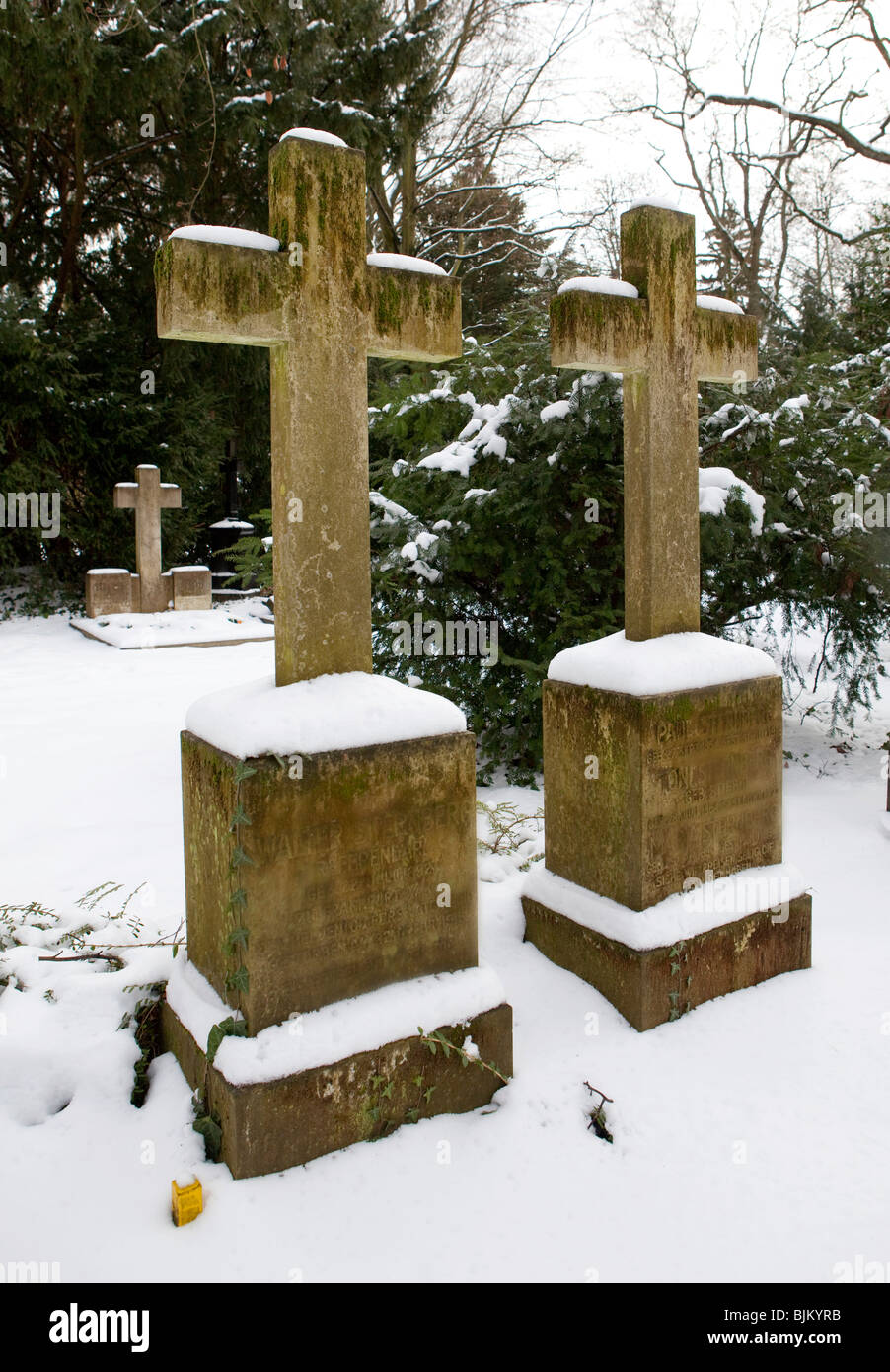 Snow-covered graveyard, neglected, unkempt graves Stock Photo