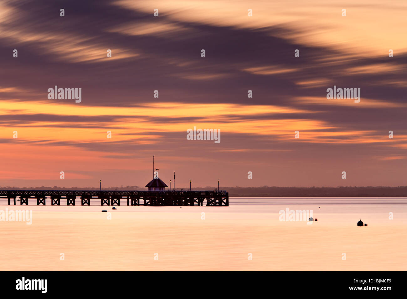 Sun setting over Yarmouth Pier. Isle of Wight, England, UK Stock Photo