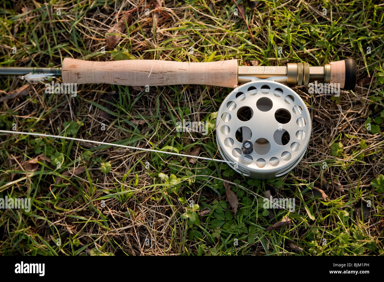Fly fishing reel line and rod handle. Stock Photo