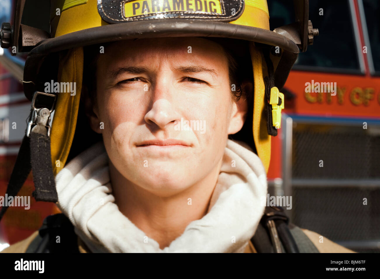 Portrait of a firefighter smiling Stock Photo - Alamy