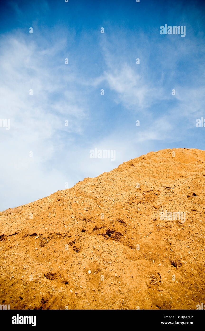 a hill of terrain against a blue clear sky Stock Photo