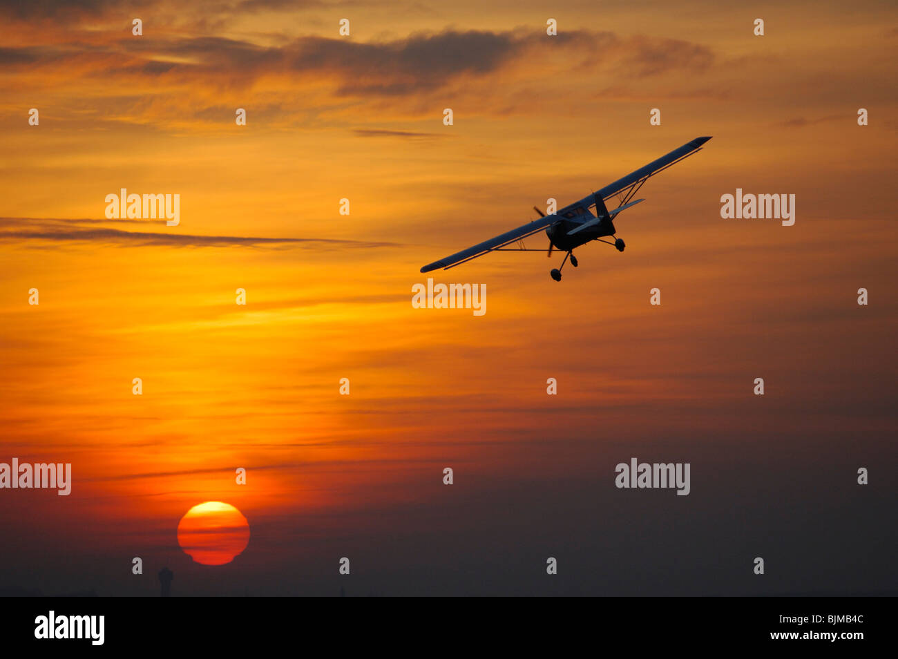 Ultra light aircraft Eurofox turning on a sunset sky. Sarreguemines