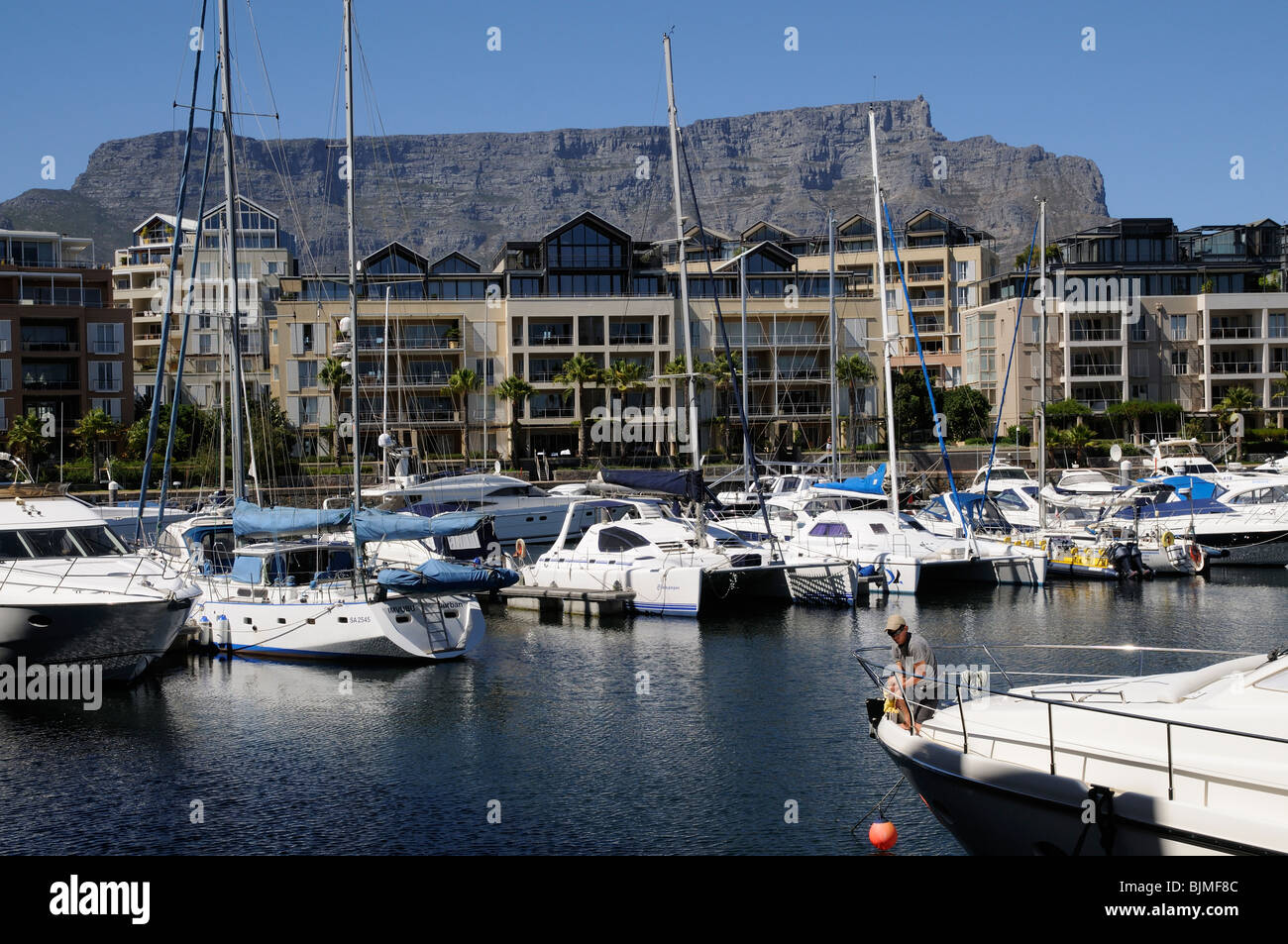 Luxury waterfront properties and moorings overlooked by Table Mountain Cape Town South Africa Stock Photo