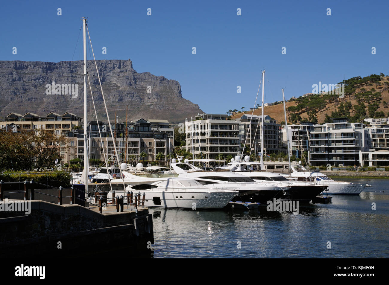 Luxury waterfront properties and moorings overlooked by Table Mountain & Signal Hill Cape Town South Africa Stock Photo