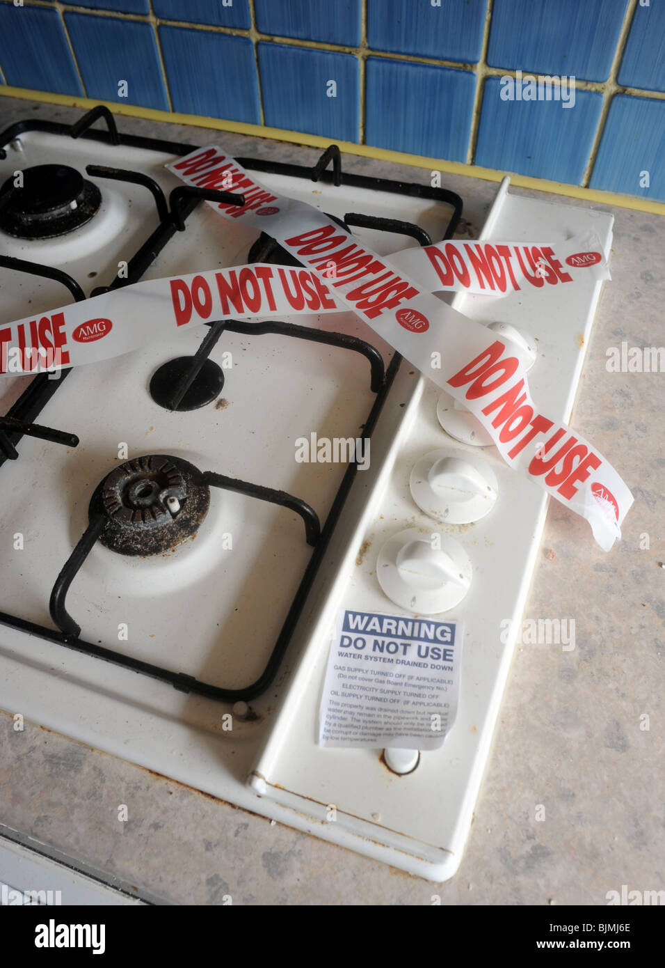 DOMESTIC GAS HOB COOKER WITH 'DO NOT USE' WARNING STICKER TAPE OVER IT,UK Stock Photo
