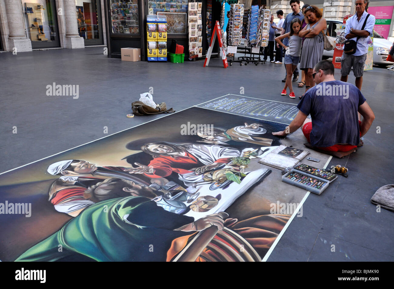 Street painter painting the 'Supper at Emmaus' by Caravaggio, Via del Corso, Rome, Lazio, Italy, Europe Stock Photo