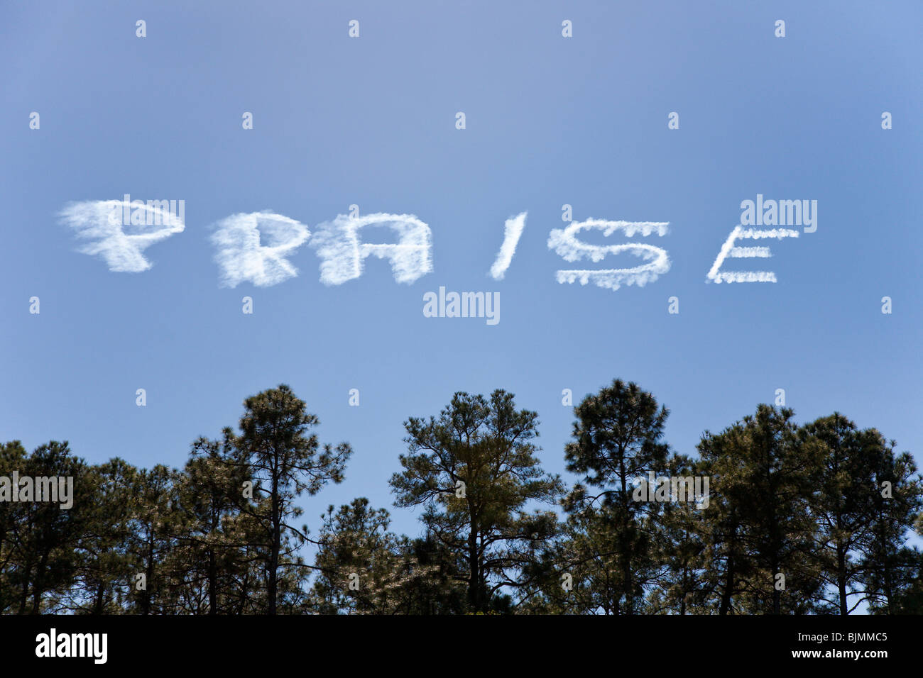 Central Florida - Jan 2009 - The word 'Praise' in skywriting over Central Florida. Stock Photo