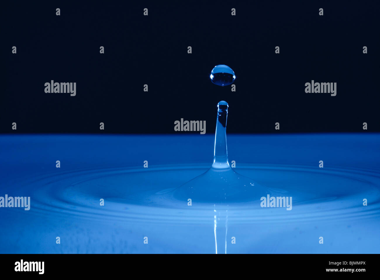 Water drop hitting a water surface Stock Photo Alamy