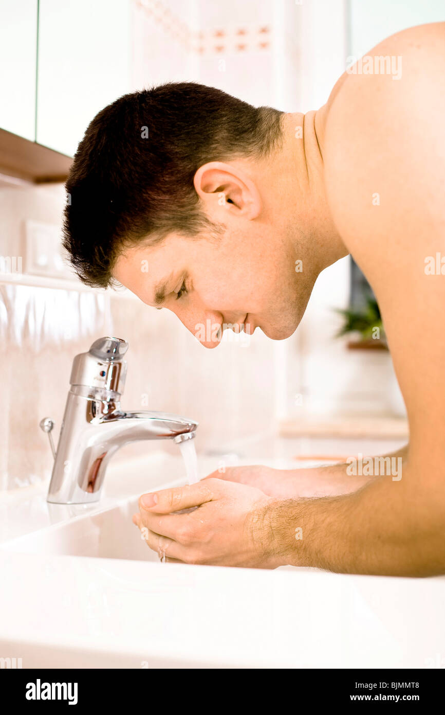 Young man shaving Stock Photo