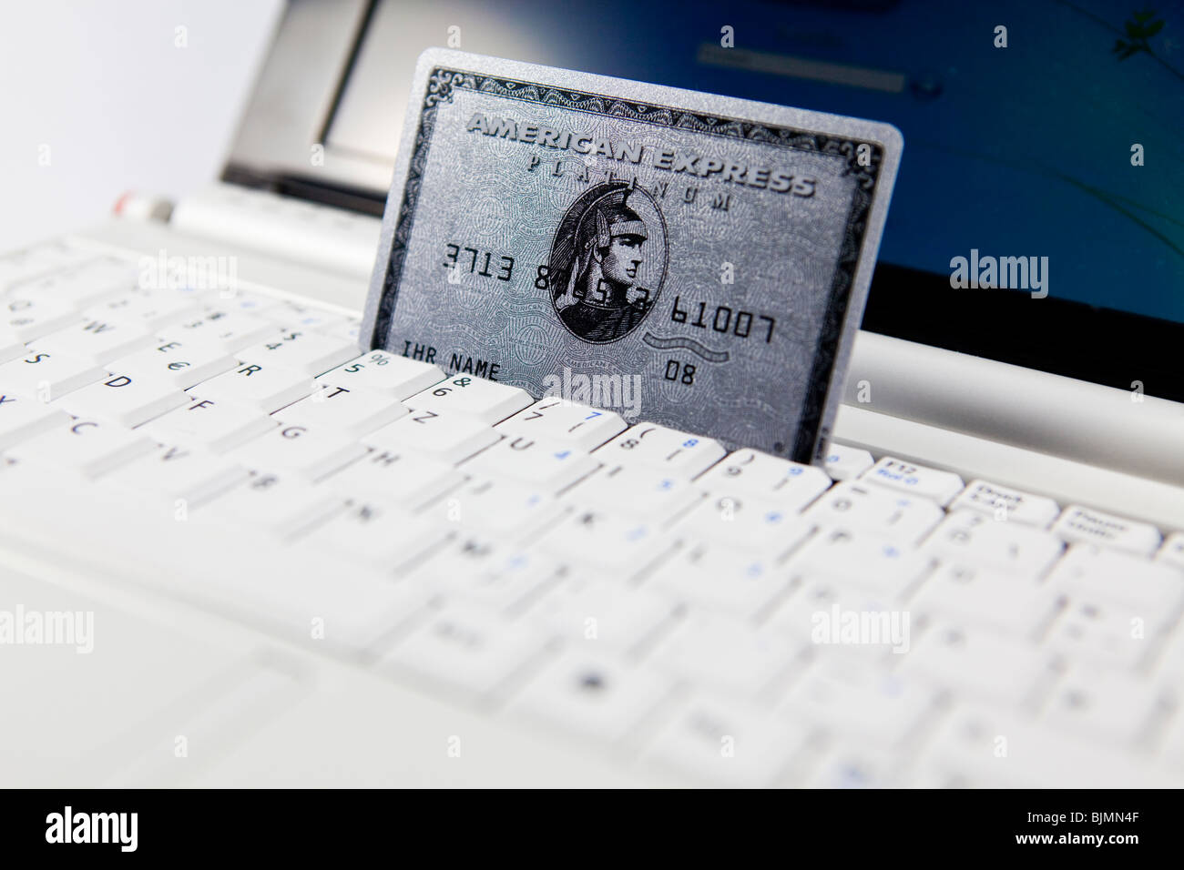 Business done on a notebook via credit card, money transfer by credit