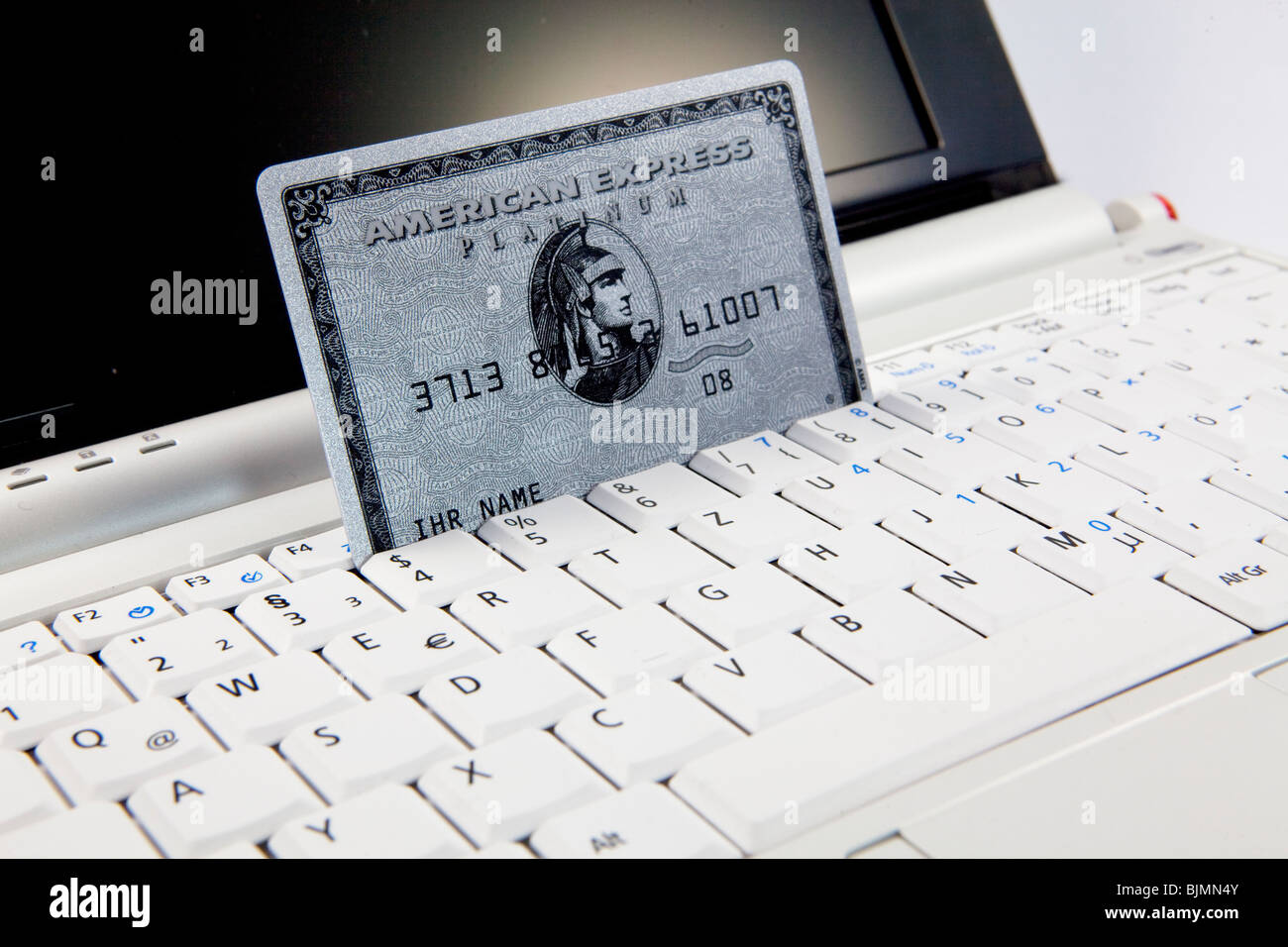 Business done on a notebook via credit card, money transfer by credit