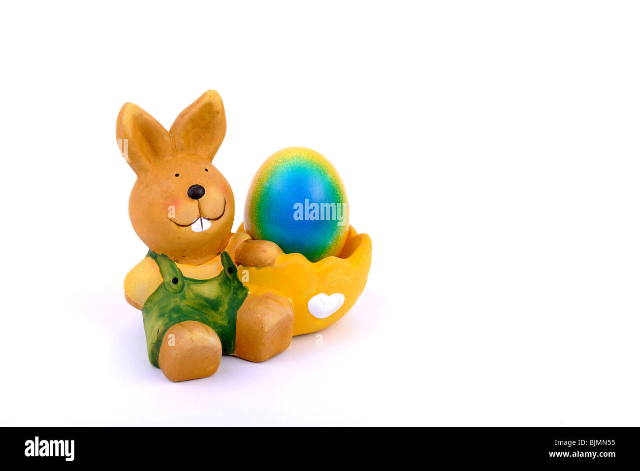Egg cup with Easter bunny with colorful, dyed Easter egg Stock Photo