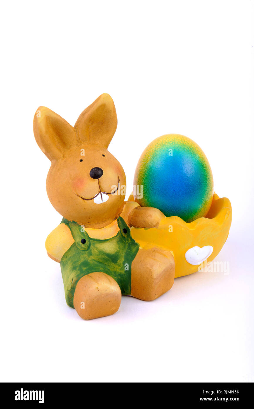 Egg cup with Easter bunny with colorful, dyed easter egg Stock Photo