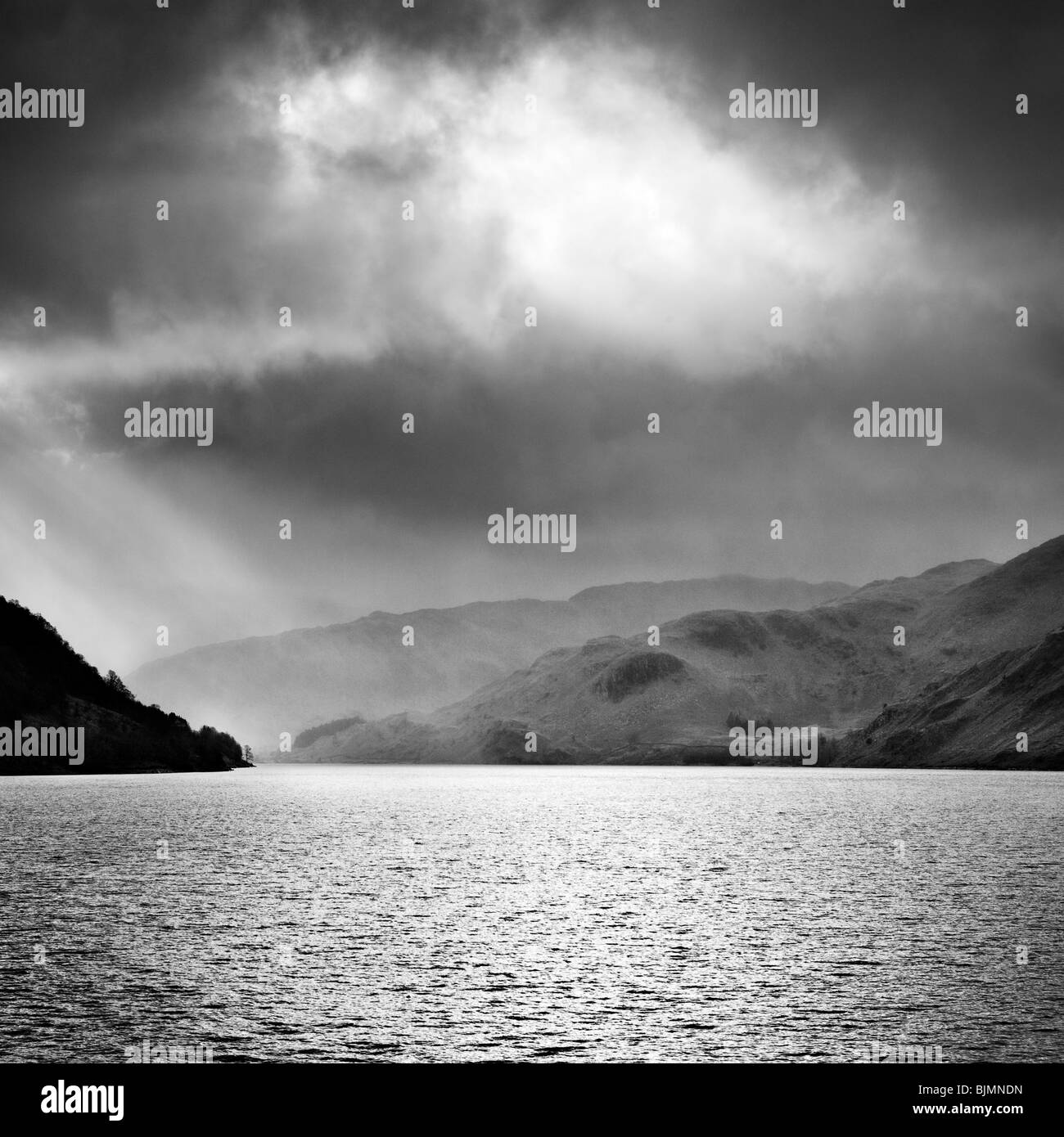 Sun shining through clouds above Haweswater. Isle of Wight, England, UK Stock Photo