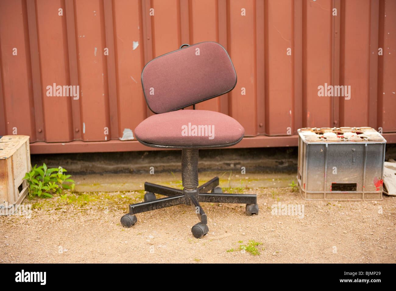 Broken brown office swivel chair still life Stock Photo