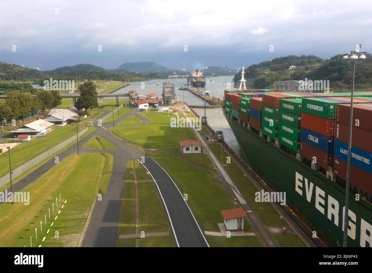 Cargo Ship with Containers going through the Panama Canal Stock Photo