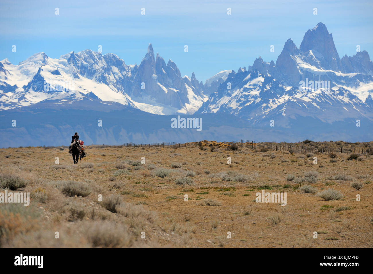 Mounted goucho in front the Andes with Mt. Fitz Roy and Mt. Cerro Torre, El Chalten, Andes, Patagonia, Argentina, South America Stock Photo