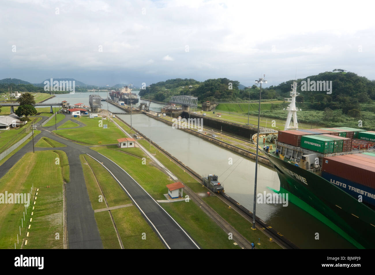 Cargo Ship with Containers going through the Panama Canal Stock Photo