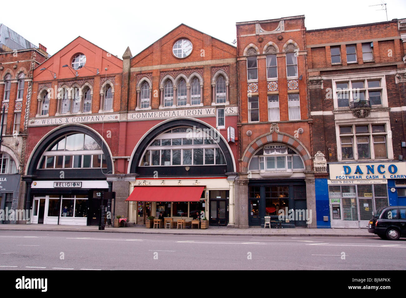 A row of London shops in an old ironworks Stock Photo