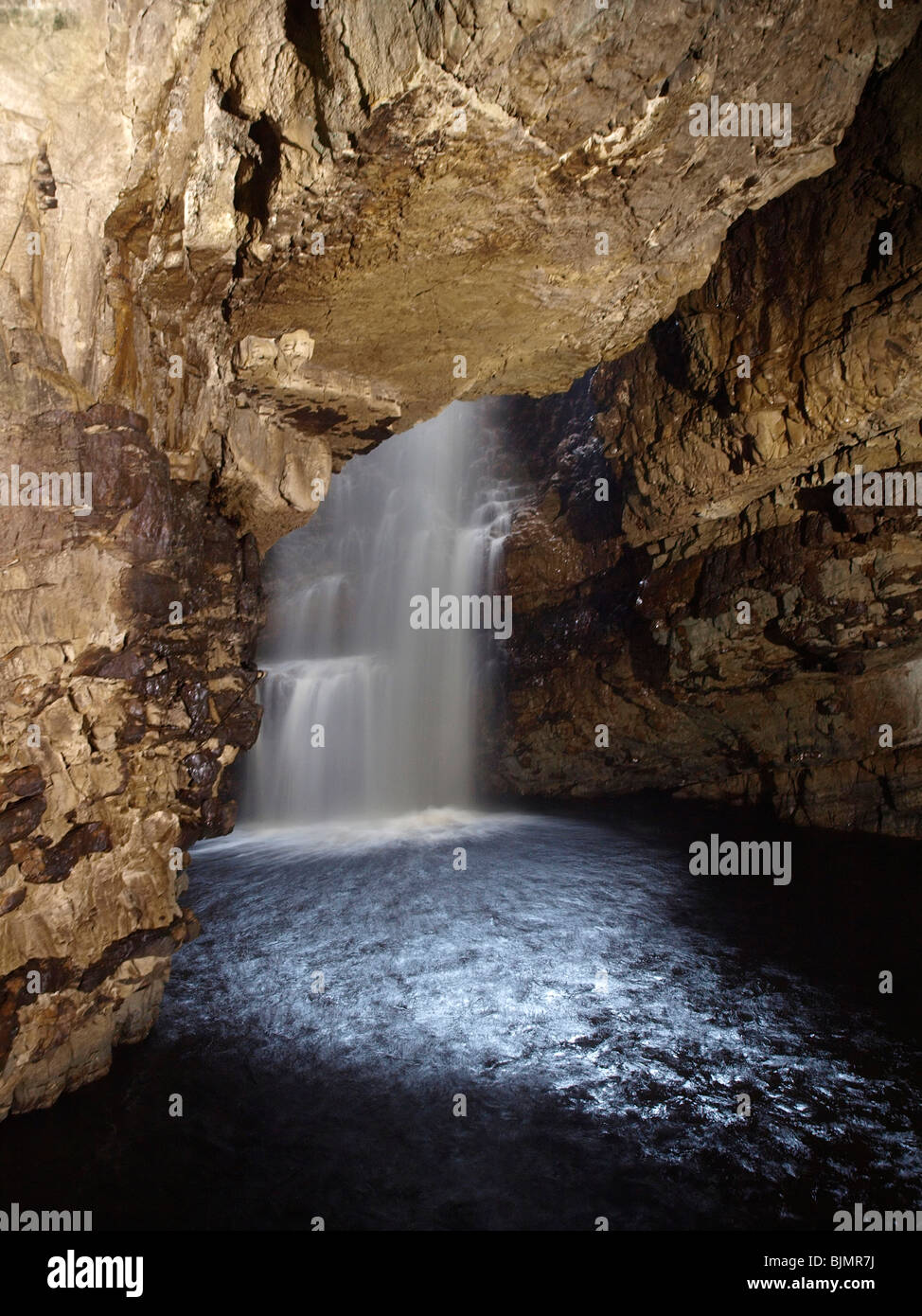 water fall inside the smoo cave, highlands Stock Photo Alamy