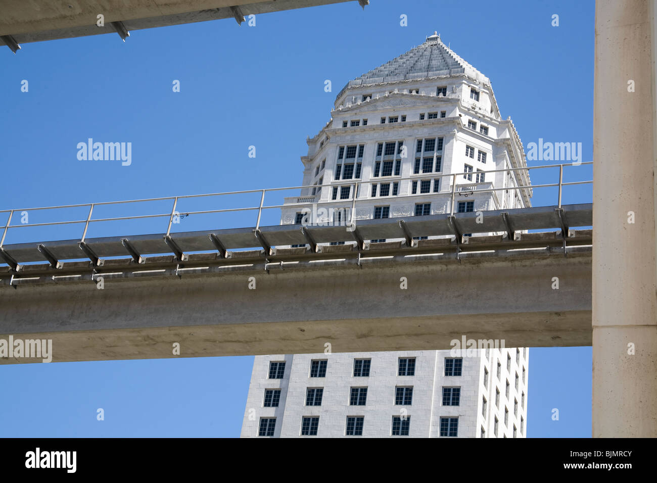 The bridge carrying the Miami Metrorail past Dade County Courthouse Downtown District Miami Florida Stock Photo