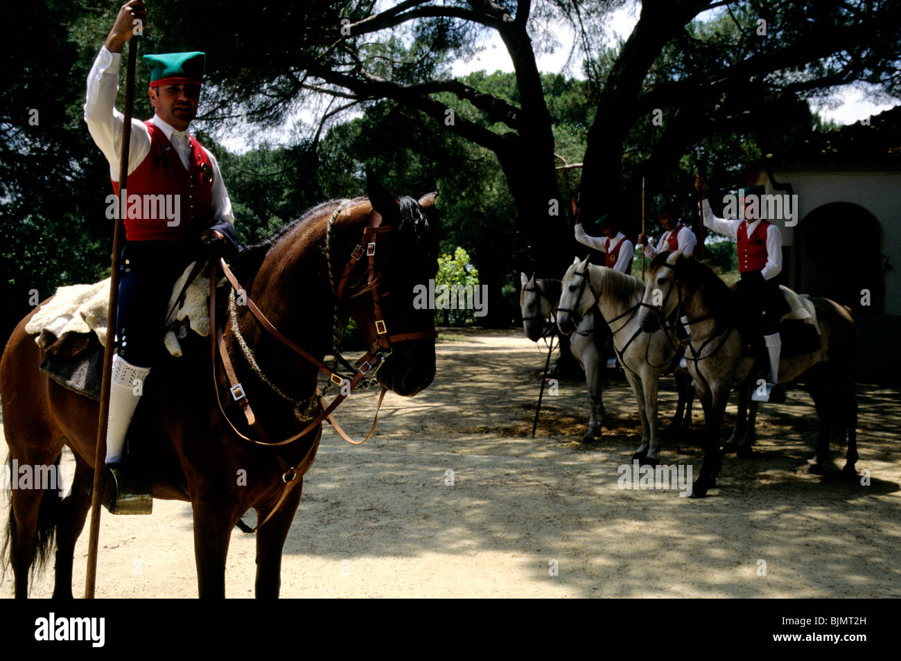 Portuguese horseman of the Ribatejo, known as campinos and easily identified by their red waistcoats and green caps Stock Photo