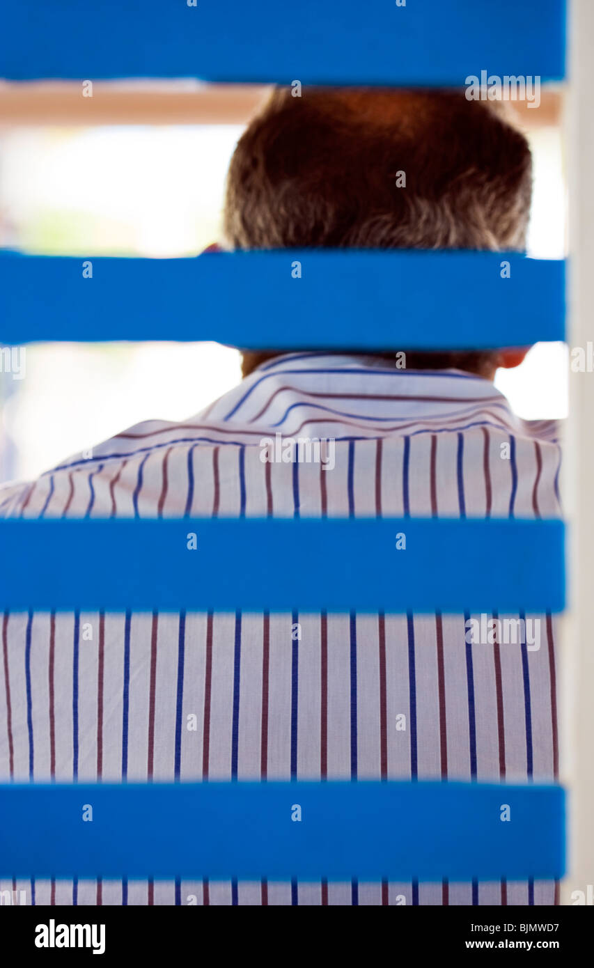 ABSTRACT SHALLOW FOCUS IMAGE OF A MAN WEARING A STRIPED SHIRT Stock Photo