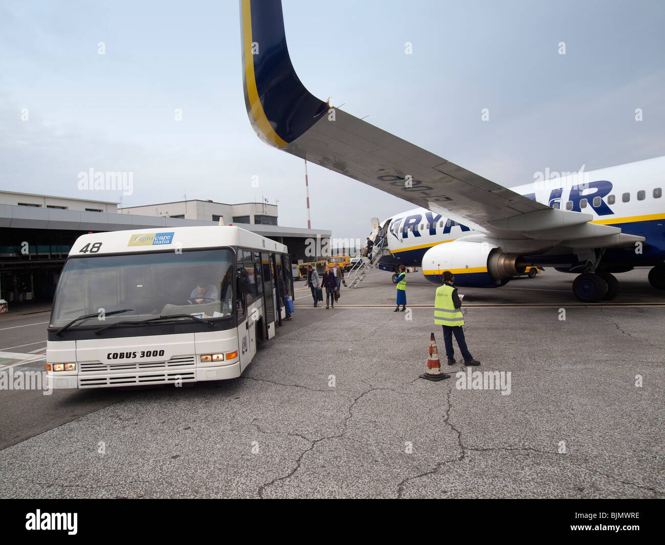 Tourists leaving Ryanair aeroplane on Ciampino airport near Rome, Italy Stock Photo
