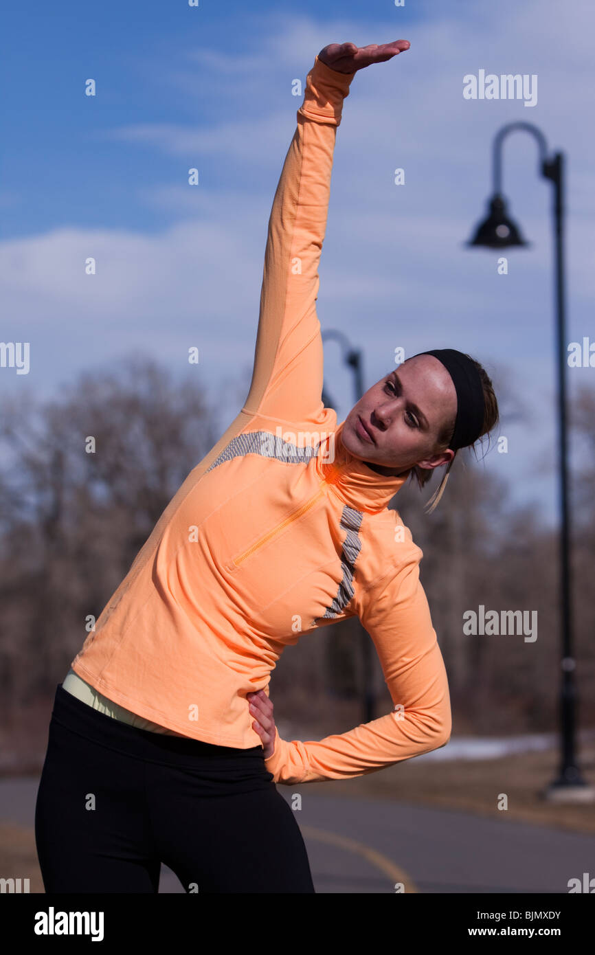 Stretching woman fitness exercise hi-res stock photography and images ...