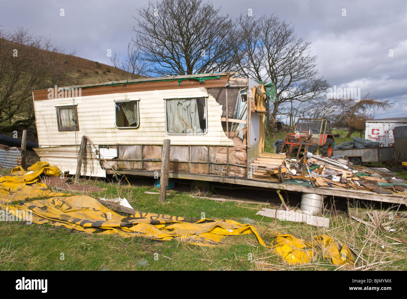 Derelict residential caravan on remote farmstead on mountainside above Pontypool Torfaen South Wales UK Stock Photo