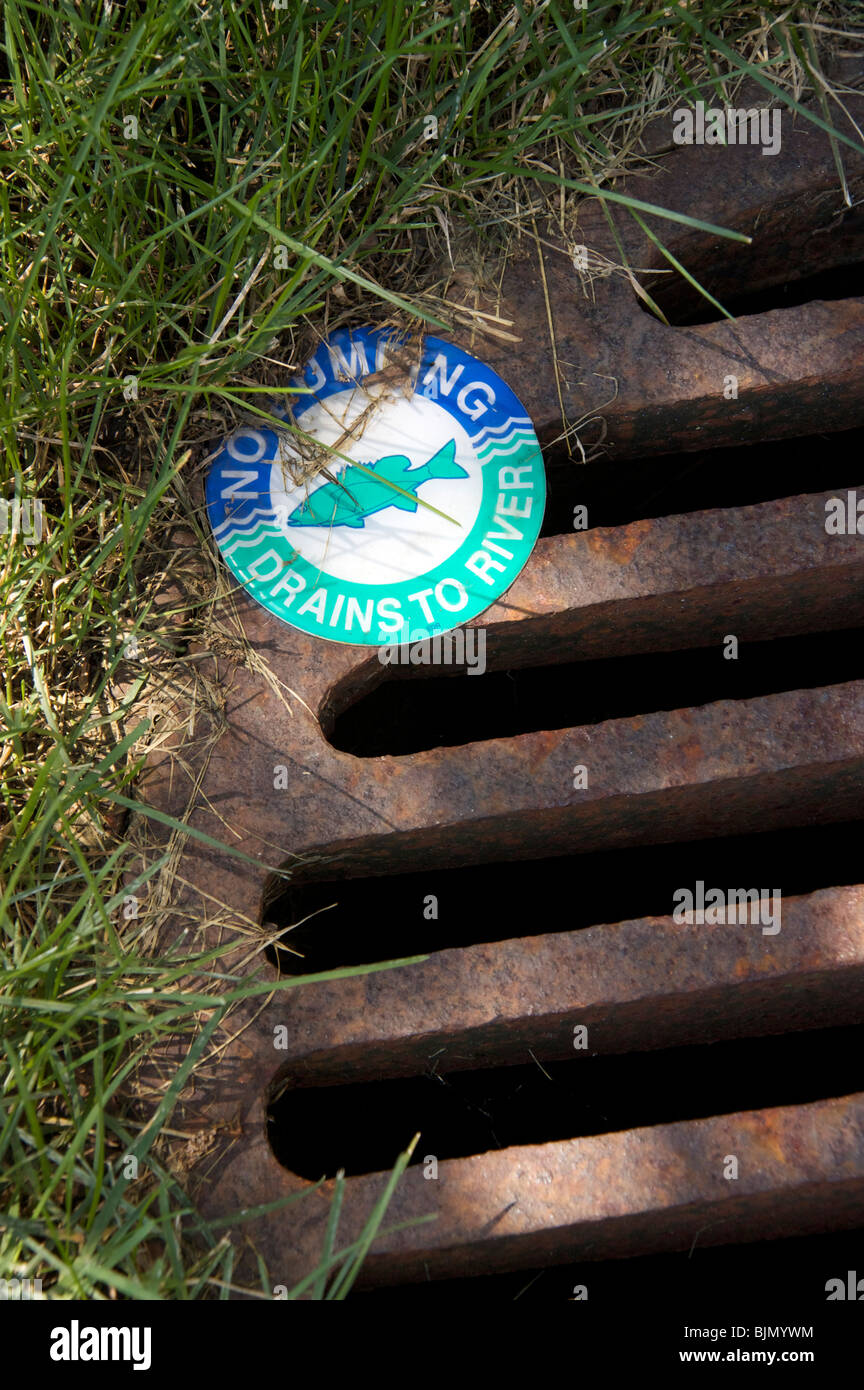 No dumping warning on storm drain to river Stock Photo Alamy
