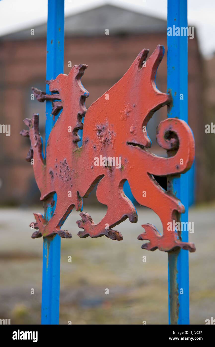 Welsh dragon on gates of derelict former engineering factory near ...