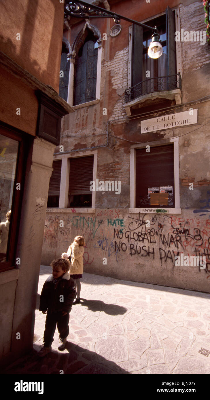 Venice, March 2008 -- 'No Global War! No Bush Day' graffiti on a housewall Stock Photo