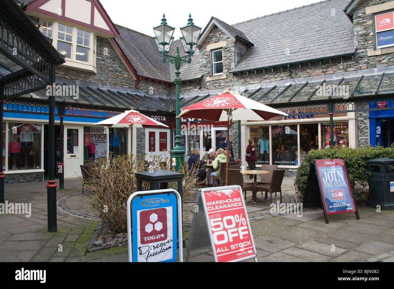Ambleside Lake District Cumbria England UK People sitting outside a Costa Coffee house in this town popular with walkers Stock Photo