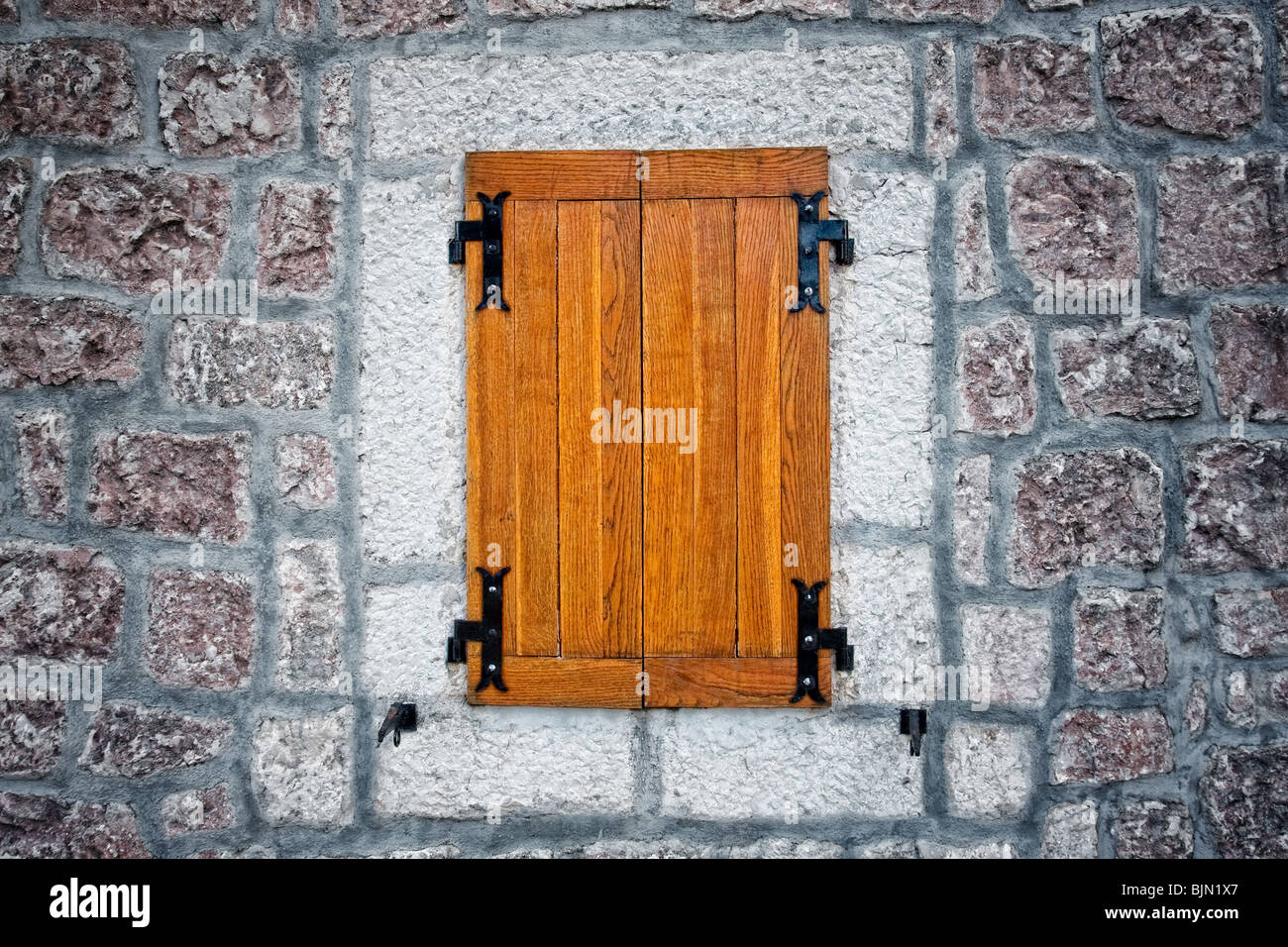 Wooden rustic antique window and textured stone wall Stock Photo - Alamy