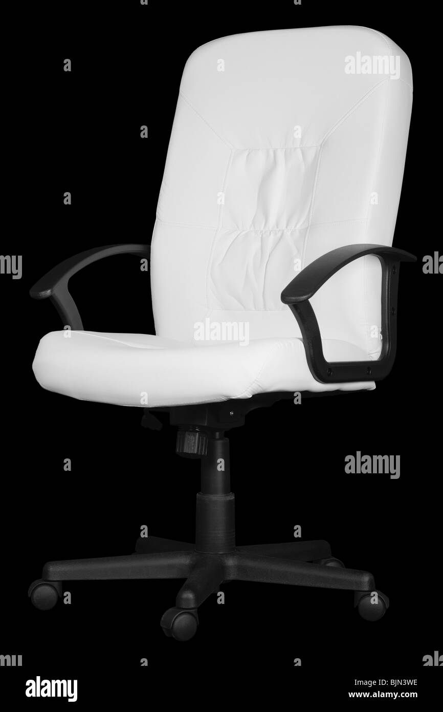 A large white office chair isolated on black background Stock Photo