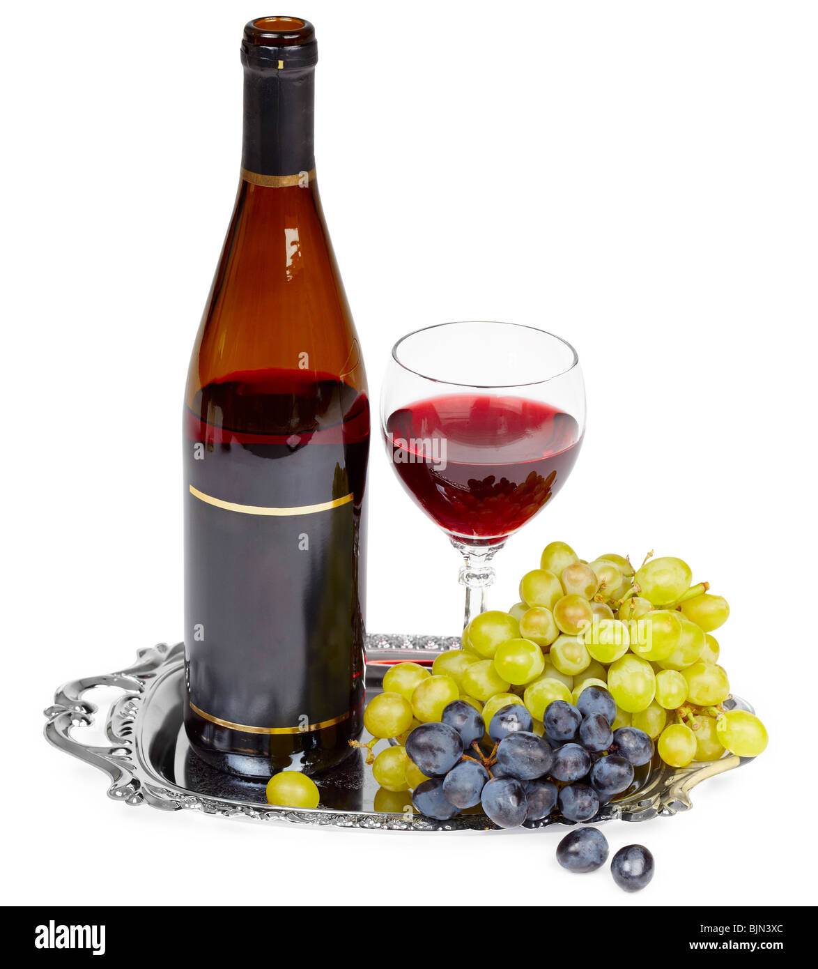 Beautiful still life - a bottle of wine, glass and grapes on a metal tray Stock Photo