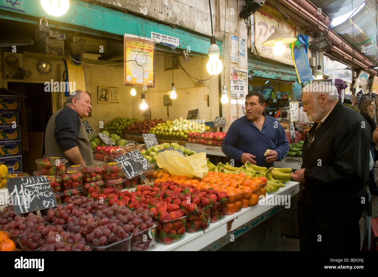 Vendors in Mahane or Machane Yehuda market often referred to as 'The Shuk', an open-air, marketplace in West Jerusalem, Israel Stock Photo