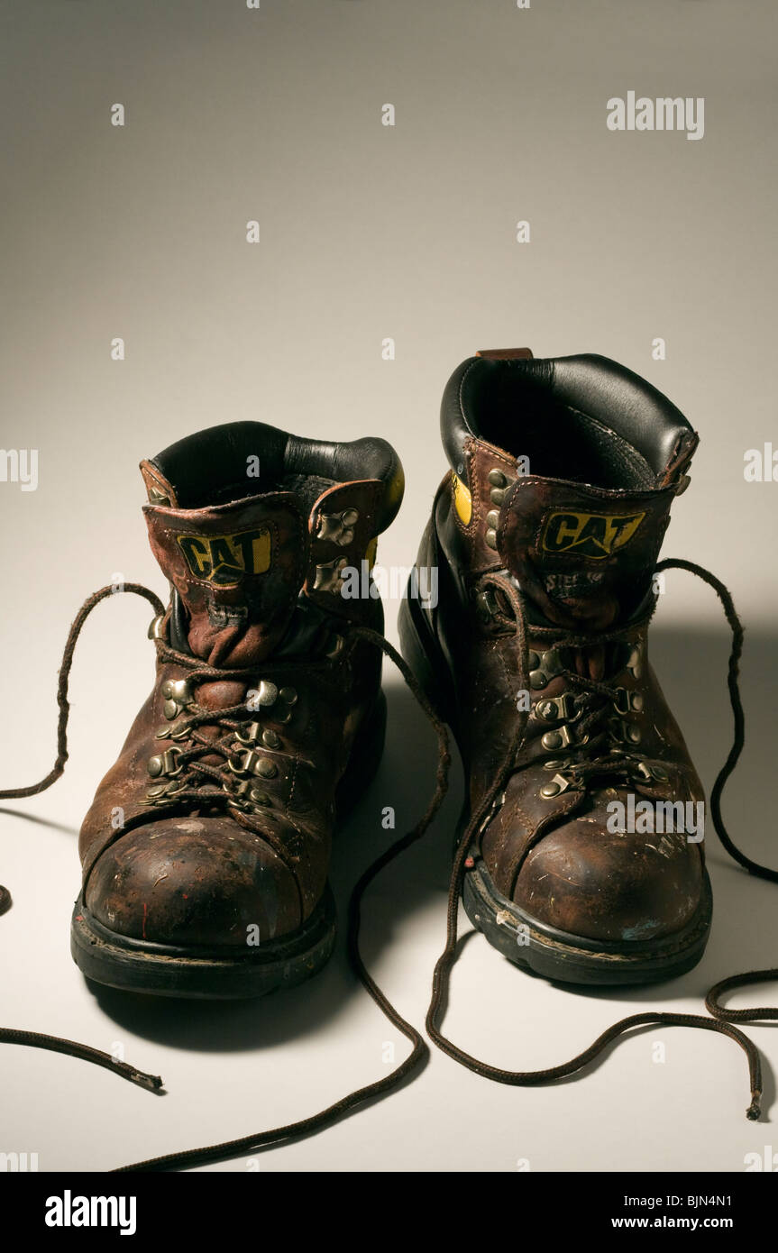 Caterpillar Steel Toed Work Boots on White Background. Stock Photo